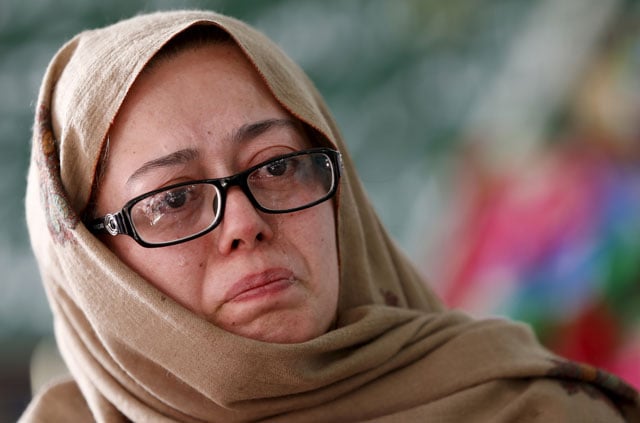 gul e rana mother of mohammad ali khan cries as she describes her son in the rooftop shrine for hassan zeb in peshawar pakistan december 11 2015 the family of hassan zeb have created a rooftop shrine for their son covered with pictures of the 134 students and 16 staff killed in the taliban attack on the army public school in peshawar it has become a central gathering place for all the families photo reuters