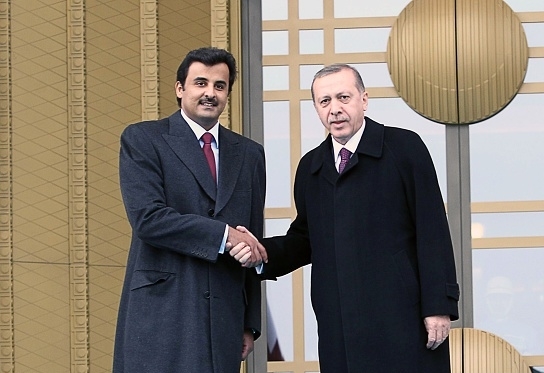 emir of qatar sheikh tamim bin hamad bin khalifa al thani l is welcomed by turkish president recep tayyip erdogan in this file photo photo afp