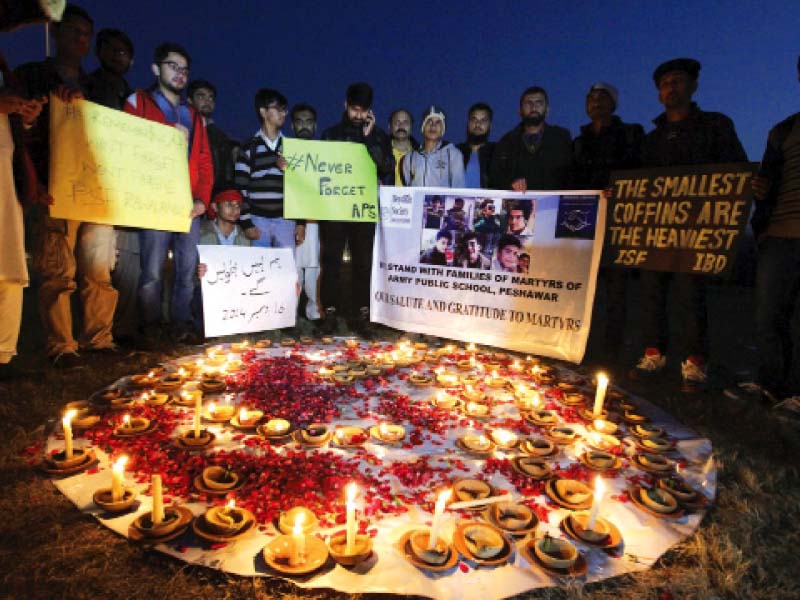 locals hold candlelight vigils for aps peshawar victims on the anniversary of the attack photo reuters