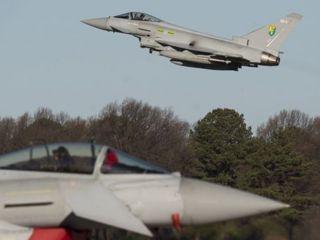 a royal air force eurofighter typhoon aircraft flies on dec 15 during the inaugural trilateral exercise between the us air force united kingdom 039 s royal air force and the french air force at joint base langley eustis in hampton va photo afp