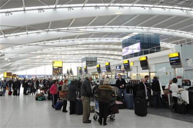 passengers queue to check in at terminal 5 at heathrow airport photo reuters passengers queue to check in at terminal 5 at heathrow airport photo reuters