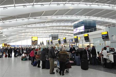 passengers queue to check in at terminal 5 at heathrow airport photo reuters