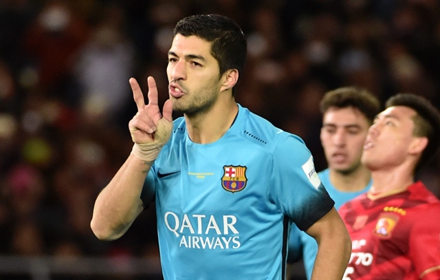 barcelona forward luis suarez celebrates his goal against guangzhou evergrande during their club world cup semi final photo afp