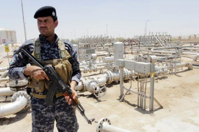 a member from the oil police force stands guard at zubair oilfield in basra southeast of baghdad june 18 2014 photo reuters a member from the oil police force stands guard at zubair oilfield in basra southeast of baghdad june 18 2014 photo reuters