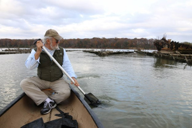 marine archaeologist don shomette paddles a canoe among the remains of decaying sunken vessels left over from world war i in mallows bay near nanjemoy maryland on november 17 2015 photo afp marine archaeologist don shomette paddles a canoe among the remains of decaying sunken vessels left over from world war i in mallows bay near nanjemoy maryland on november 17 2015 photo afp
