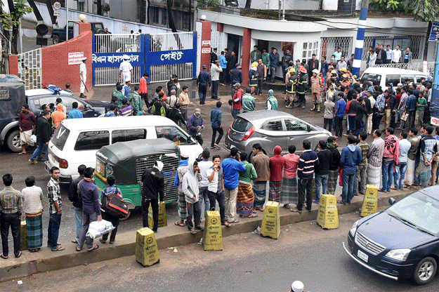 onlookers gather outside the isha khan naval base where two small bombs exploded at a mosque in chittagong on december 18 2015 photo afp