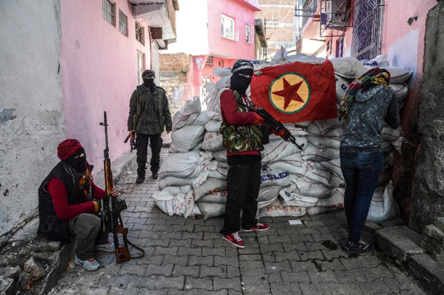 a kurdish workers party pkk flag hangs on a barricade in the sur district of diyarbakir southeastern turkey on november 18 2015 photo afp