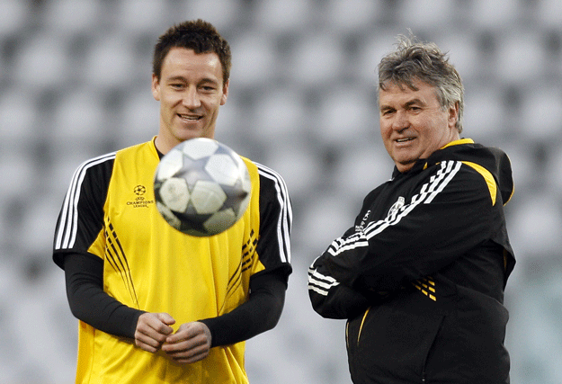 a picture taken on march 9 2009 shows chelsea 039 s dutch manager guus hiddink r talking with chelsea 039 s john terry l during a training session on the eve of a champions league football match against juventus at the olympic stadium in turin photo afp