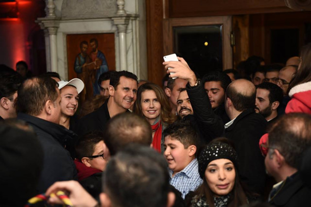 syrian president bashar al assad with his wife in a church on december 19 2015 photo syrian presidency facebook page syrian president bashar al assad with his wife in a church on december 19 2015 photo syrian presidency facebook page