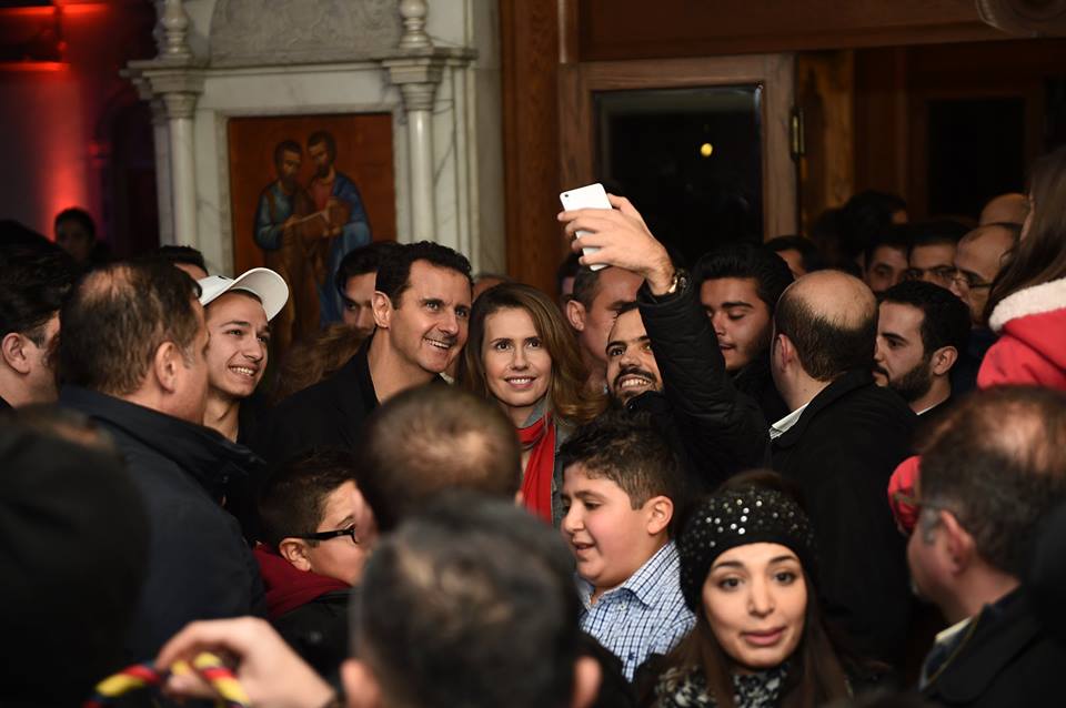 syrian president bashar al assad with his wife in a church on december 19 2015 photo syrian presidency facebook page