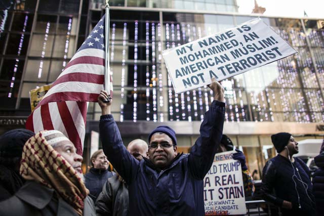 a group of muslims attend a rally in front of trump tower december 20 2015 in new york republican presidential hopeful donald trump proposed a call for a ban on muslims entering the united states photo afp