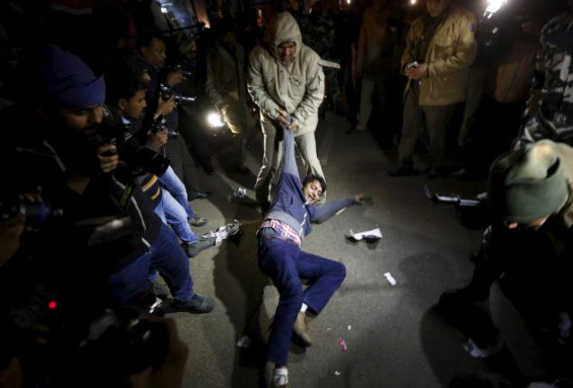 a policeman detains a demonstrator during a protest against the release of a juvenile rape convict in new delhi india december 20 2015 photo reuters