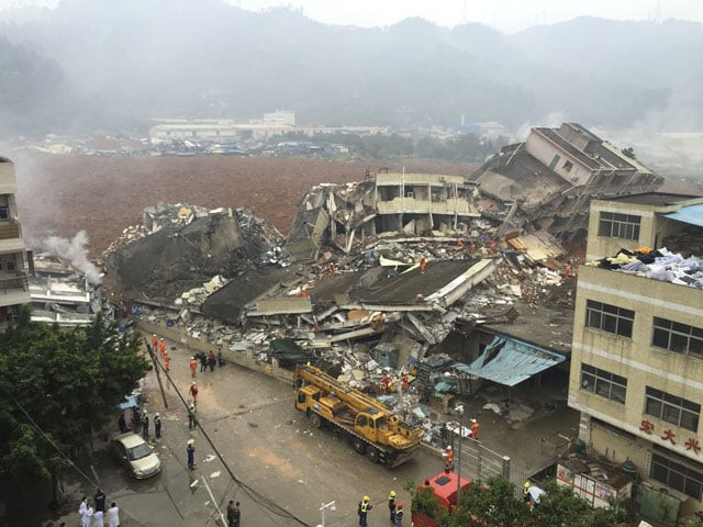 damaged buildings are seen as rescuers search for survivors after a landslide hit an industrial park in shenzhen guangdong province china on december 20 2015 photo reuters damaged buildings are seen as rescuers search for survivors after a landslide hit an industrial park in shenzhen guangdong province china on december 20 2015 photo reuters