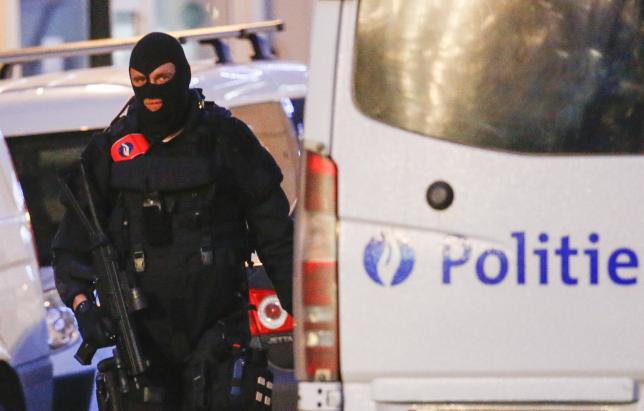 a belgian special forces police officer patrols a street during a police raid in central brussels belgium december 20 2015 which according to belgian media is in connection with last month 039 s deadly paris attack photo reuters