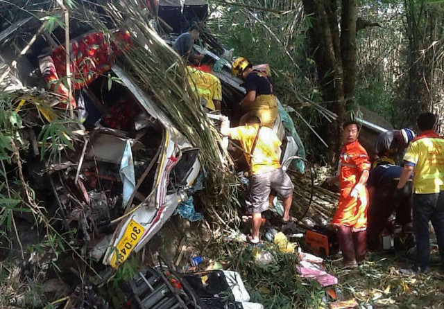 this photo taken on december 20 2015 shows thai rescue workers trying to find survivors following a bus crash in doi saket district 30 kilometres 18 miles from the northern city of chiang mai twelve malaysian tourists and a thai were killed in a bus crash in thailand a country with some of the world 039 s most dangerous roads according to information from police and a tour operator photo afp this photo taken on december 20 2015 shows thai rescue workers trying to find survivors following a bus crash in doi saket district 30 kilometres 18 miles from the northern city of chiang mai twelve malaysian tourists and a thai were killed in a bus crash in thailand a country with some of the world 039 s most dangerous roads according to information from police and a tour operator photo afp