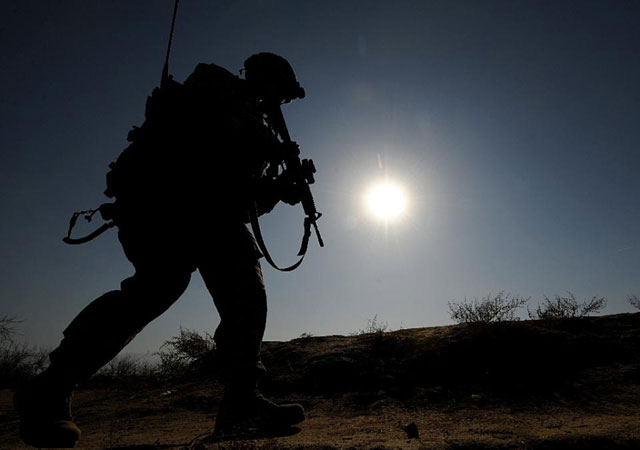 a us soldier patrols a village outside bagram airbase on the outskirts of kabul photo afp