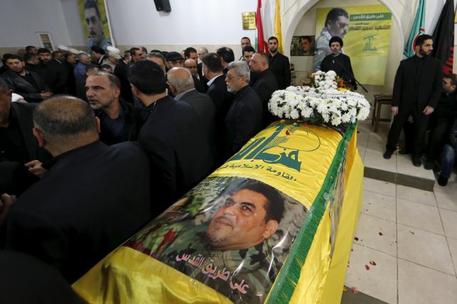 people offer their condolences near the coffin of lebanese hezbollah militant leader samir qantar during his funeral in beirut 039 s southern suburbs lebanon december 21 2015 photo reuters