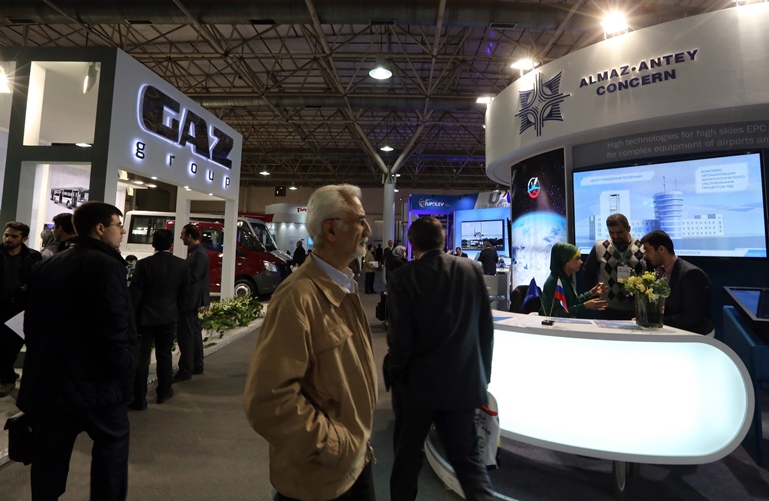 iranian men visit the stands of russian companies on december 22 2015 during the russia national industrial exhibition in tehran photo afp