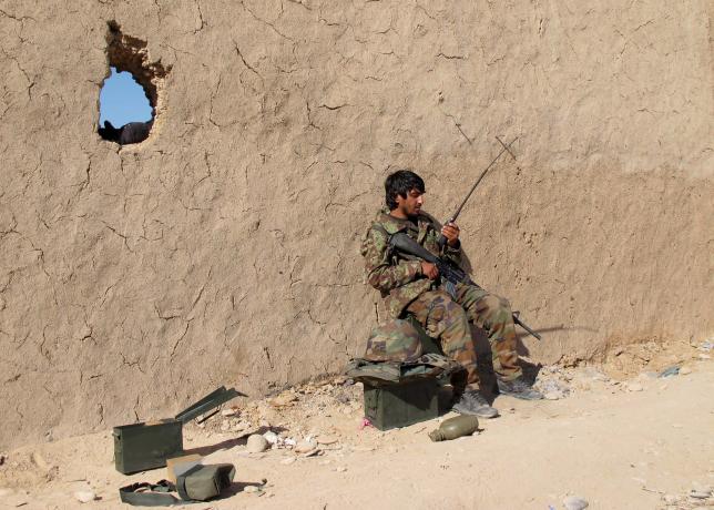 an afghan national army ana soldier speaks on a radio at an outpost in helmand province december 20 2015 photo reuters