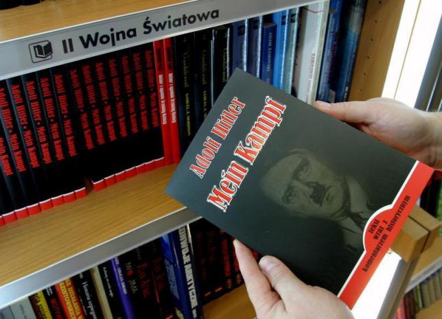 a customer holds a polish copy of adolf hitler 039 s mein kampf at a book store in wroclaw south western poland on february 23 2005 photo reuters