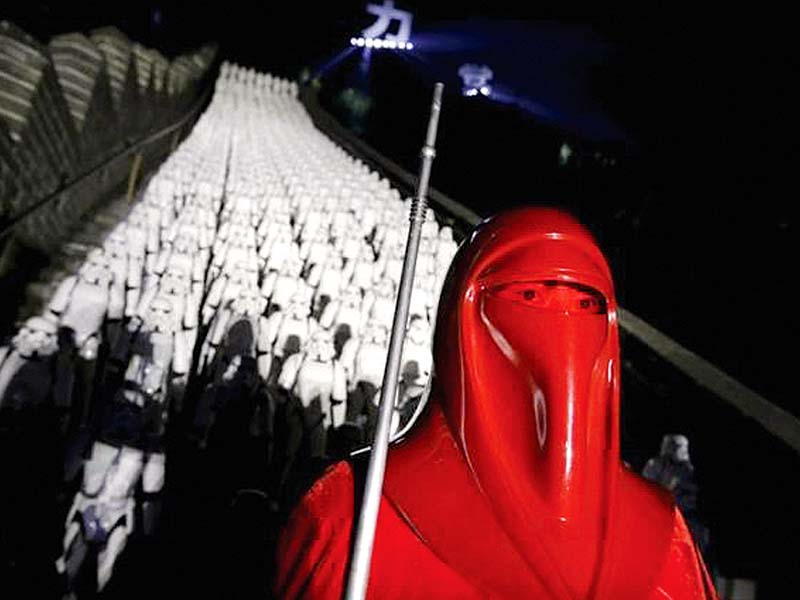 fan dressed as star wars character poses in front of 500 replicas of the stormtrooper characters during star wars the force awakens promotions photo credits reuters