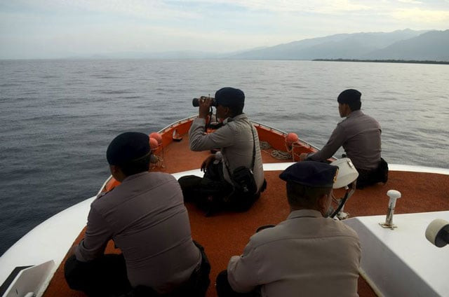 rescue team members take part in a search for passengers who were victims of a ferry sinking in the gulf of bone near kolaka off south east sulawesi indonesia on december 24 2015 photo reuters rescue team members take part in a search for passengers who were victims of a ferry sinking in the gulf of bone near kolaka off south east sulawesi indonesia on december 24 2015 photo reuters