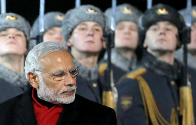 prime minister narendra modi inspects the honour guard during a welcoming ceremony upon his arrival at moscow 039 s vnukovo airport russia december 23 2015 photo reuters