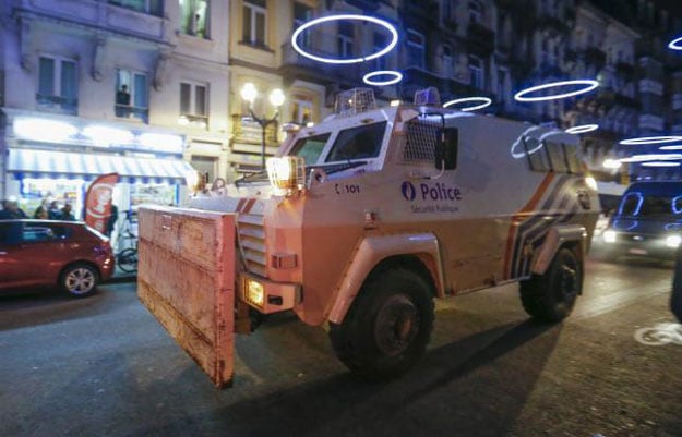 an armoured vehicle is seen while belgian special forces patrol during a police raid in central brussels belgium december 20 2015 which according to belgian media is in connection with last month 039 s deadly paris attack photo reuters