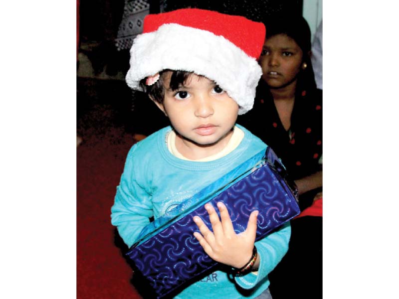 the children of the gospel church of living god in essa nagri got a special surprise in the form of christmas presents and sweets photos aysha saleem express