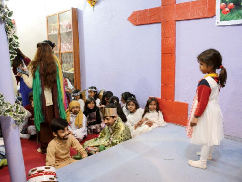 children perform a tableau at a church in islamabad as part of christmas celebrations photo express