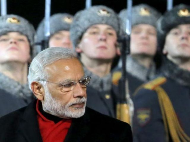 prime minister narendra modi inspects the honour guard during a welcoming ceremony upon his arrival at moscow 039 s vnukovo airport russia december 23 2015 photo reuters