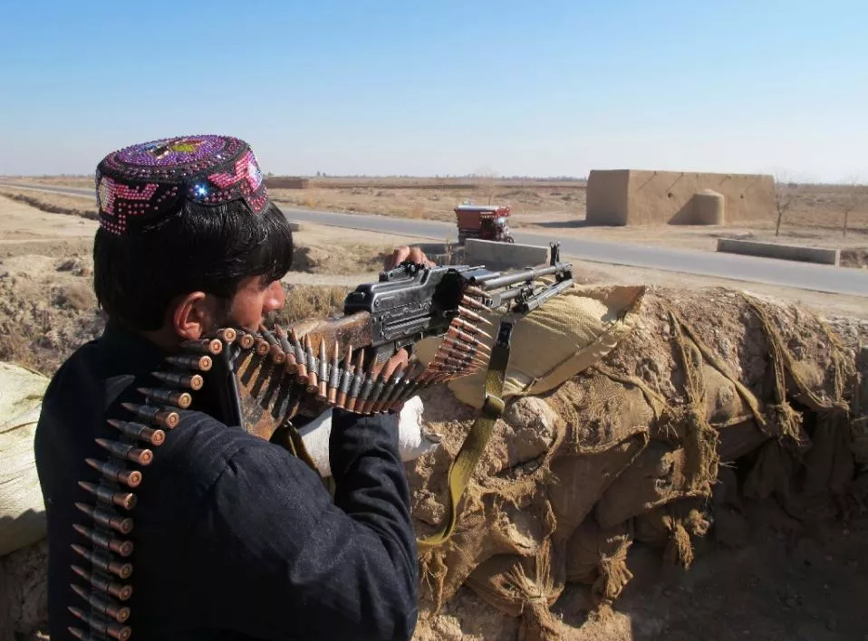 afghan police keep watch during an ongoing battle with taliban militants in the marjah district of helmand province on december 23 2015 photo afp afghan police keep watch during an ongoing battle with taliban militants in the marjah district of helmand province on december 23 2015 photo afp