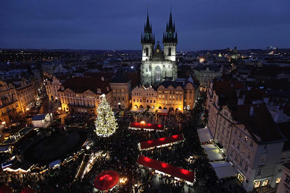a christmas tree is illuminated as the traditional christmas market opens in the old town square in prague czech republic photo reuters