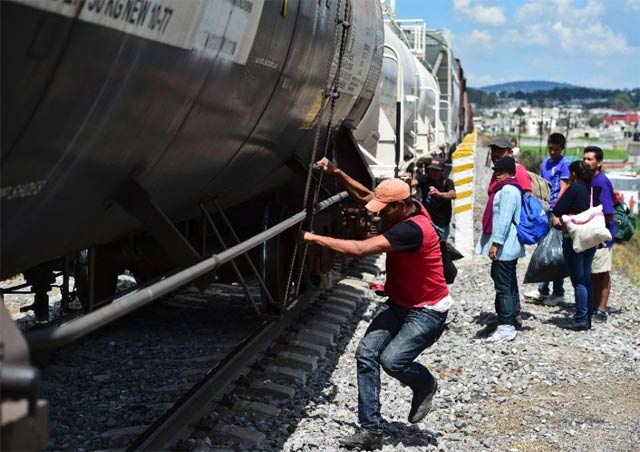 central american migrants get on the so called la bestia the beast cargo train in an attempt to reach the us border in apizaco mexico 039 s tlaxcala state photo afp