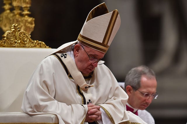 pope francis celebrates a mass on christmas eve marking the birth of jesus christ on december 24 2015 at st peter 039 s basilica in vatican photo afp