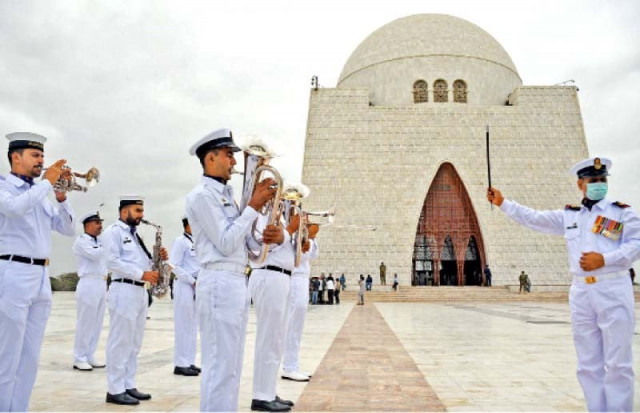 pakistan navy band plays at quaid s mazar frere hall illuminated in green lights while fishermen take out a boat rally and ssgc officials raise national flag on independence day photos express agencies pakistan navy band plays at quaid s mazar frere hall illuminated in green lights while fishermen take out a boat rally and ssgc officials raise national flag on independence day photos express agencies