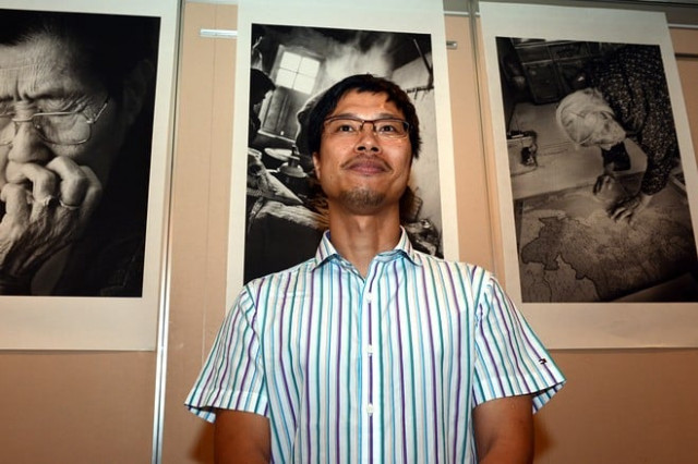 ahn sehong stands before his photographs of korean quot comfort women quot prior to a press conference in tokyo photo afp ahn sehong stands before his photographs of korean quot comfort women quot prior to a press conference in tokyo photo afp