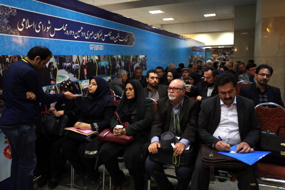 iranian hopefuls wait to register their candidacy for either the upcoming parliamentary or the assembly of experts elections at the interior ministry in tehran on december 21 2015 photo afp