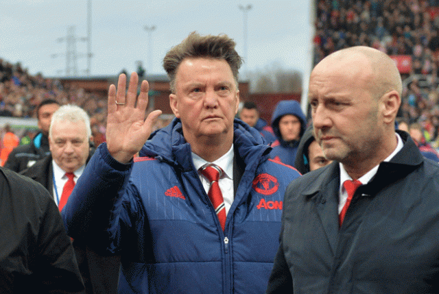 louis van gaal c waves as he leaves after the english premier league football match between stoke city and manchester united at the britannia stadium in stoke on trent central england on december 26 2015 photo afp