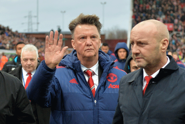 louis van gaal c waves as he leaves after the english premier league football match between stoke city and manchester united at the britannia stadium in stoke on trent central england on december 26 2015 photo afp