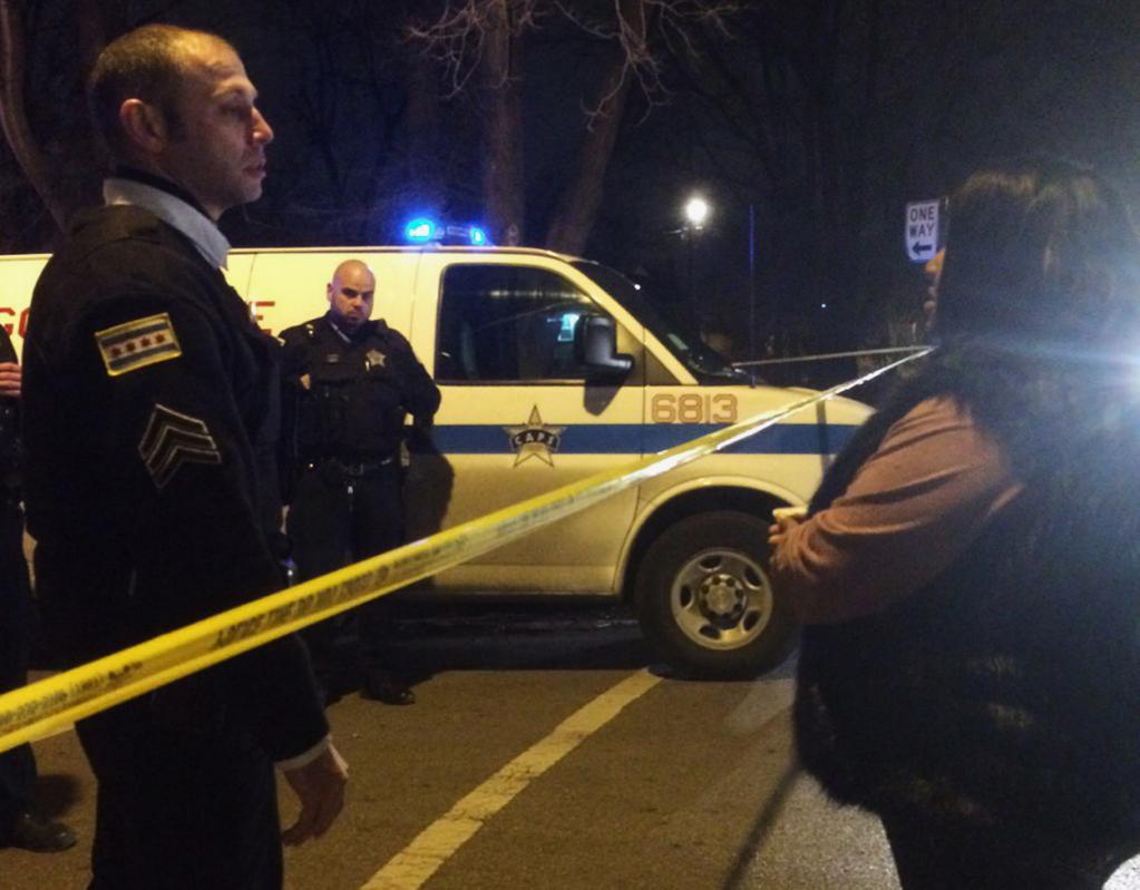 a chicago police sergeant speaks with a relative of a man who was killed by a police officer in the west garfield park neighborhood in chicago early saturday dec 26 2015 a chicago police officer shot and killed two people while responding to a domestic disturbance call in the neighborhood on the city 039 s west side police photo chicago tribune via ap