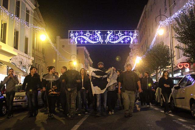 demonstrators march towards the prefecture in ajaccio during a protest on december 26 2015 a day after demonstrators vandalised a muslim prayer hall and trashed copies of the koran following a night of violence that left two firefighters and a police officer injured dozens of angry corsicans staged a fresh protest on the french mediterranean island today as condemnation poured in from muslim authorities and french officials over friday 039 s anti arab protests around 100 demonstrators shouting quot we 039 re still here quot turned out in the same low income neighbourhood of the capital ajaccio where the christmas day violence took place photo afp