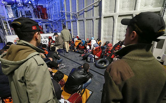 refugees in a turkish coast guard ship photo anadolu