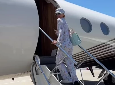 paris hilton flaunts new plane in pajamas