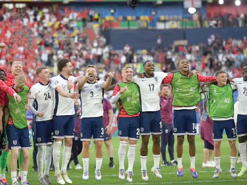 england players celebrate their victory in the round of 16 photo afp