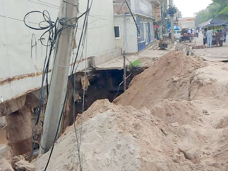 deep earth excavation by multi story plaza owners at saman abad caused abrupt breaking of a storm water channel resulting in severe flooding in the surrounding locality photo express
