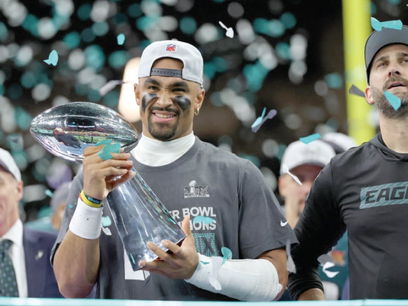 philadelphia eagles quarterback jalen hurts 1 celebrates with head coach nick sirianni after winning against kansas city chiefs in super bowl lix at caesars superdome photo reuters