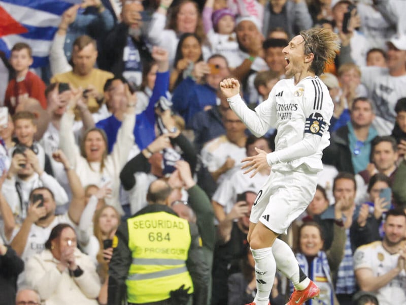 real madrid s croatian midfielder luka modric celebrates scoring the opening goal against girona photo afp