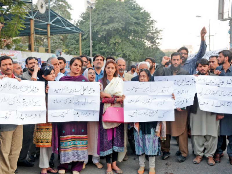 protesters gathered outside the karachi press club to demand the arrest of the killers of the university of karachi s dr wahidur rehman also known as yasir rizvi nine months have passed since his assassination but the police are no closer to solving the case photo mohammad azeem express