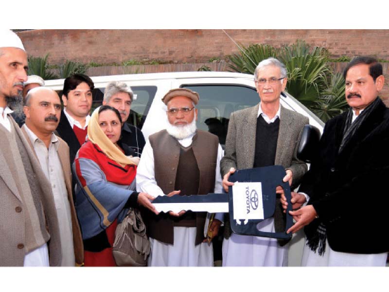 chief minister pervez khattak giving away keys of vehicles to the principals of the colleges photo inp